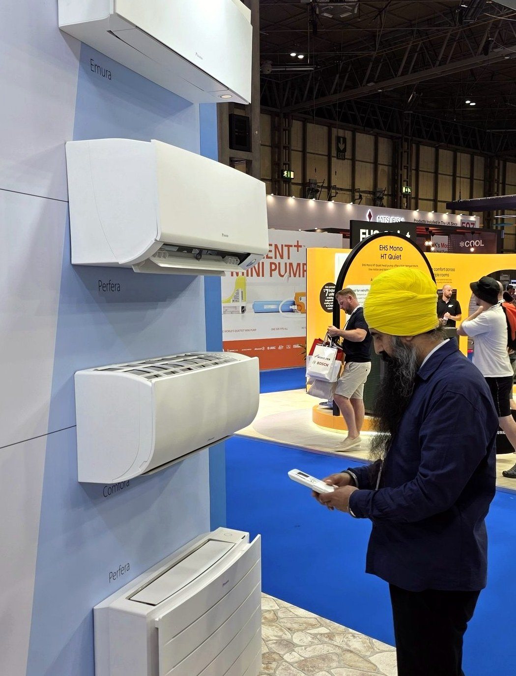 DGN GAS founder Ravinder Singh reviewing the Daikin air conditioning range at InstallerSHOW 2026