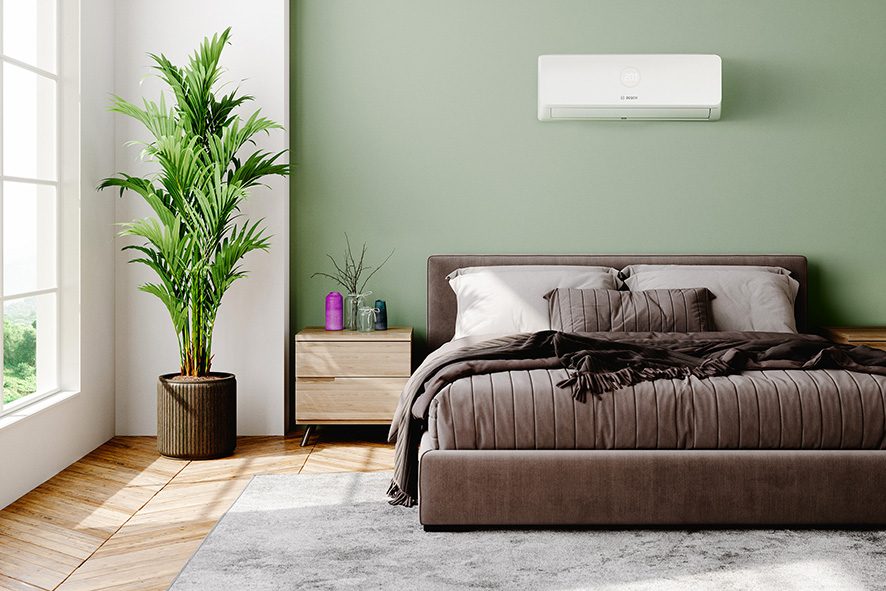 Wall-mounted air conditioning unit in a calm bedroom
