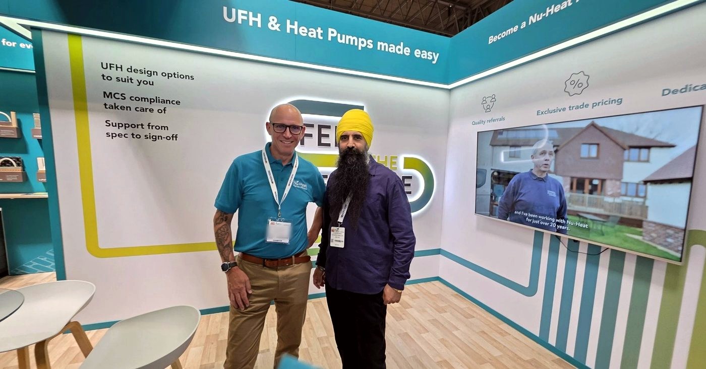 DGN GAS founder Ravinder Singh with the Nu-Heat heat pump and underfloor design team at InstallerSHOW 2026
