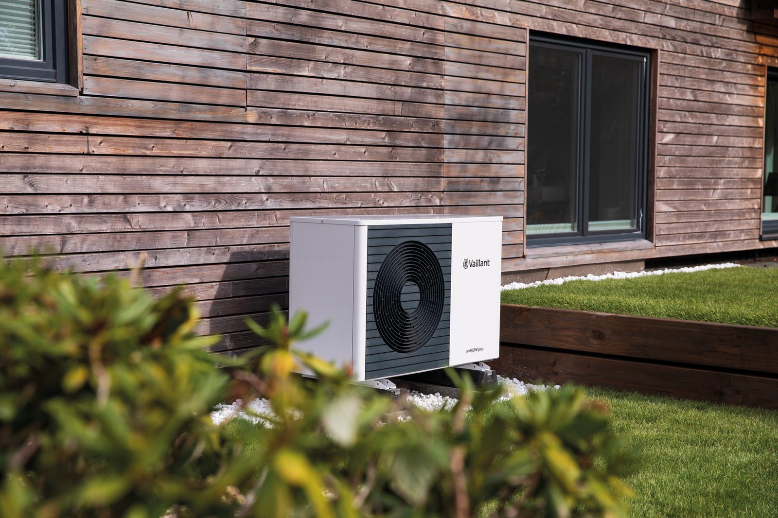 Vaillant aroTHERM plus air source heat pump outside a timber-clad home