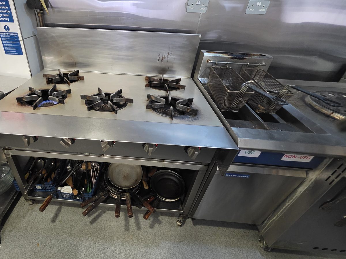 Six-burner commercial range and twin-basket fryer during a gas safety inspection by DGN GAS in Northolt, London